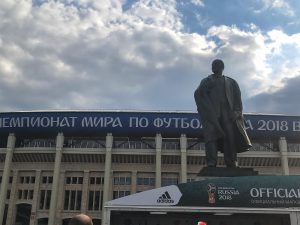 The statue is V. I. Lenin outside the main entrance to the stadium.